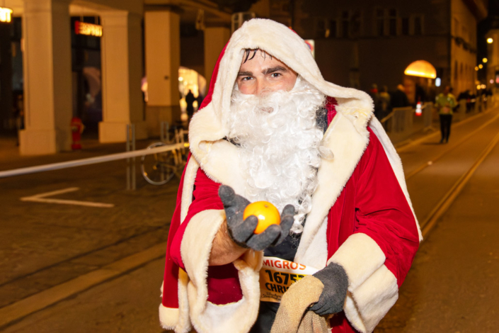 A man in a Santa Claus costume.
