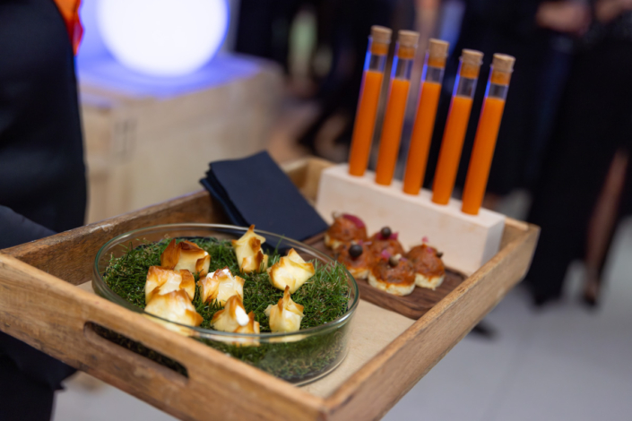 A tray of appetizers on a table at an event.